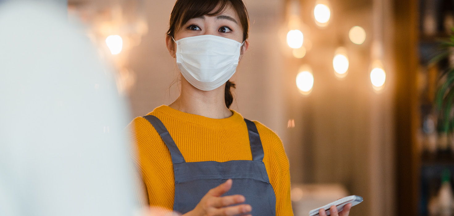 Hostess checking for vaccine passport.