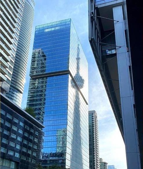 A triptych of images - downtown Toronto, a worker looking for stock on a warehouse shelf and high rises in Mississauga