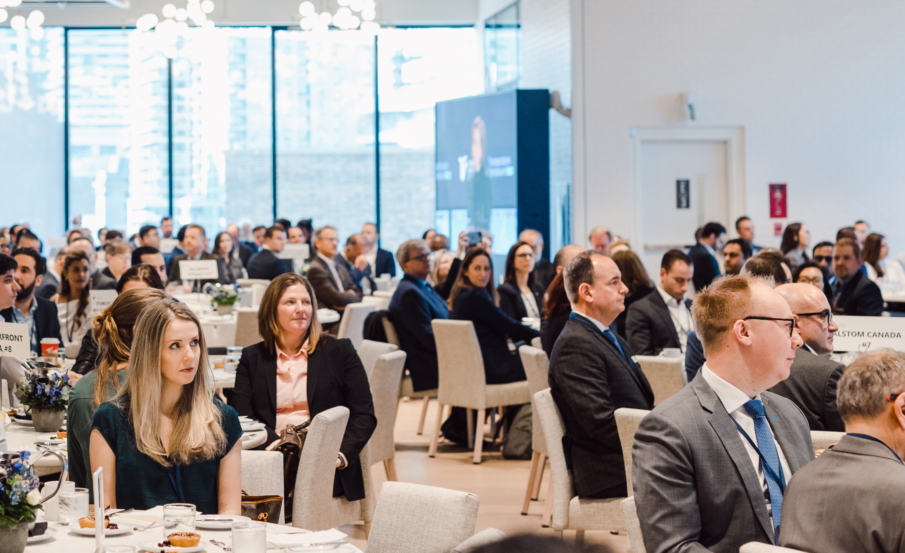 People at an event at 100 Queens Quay East