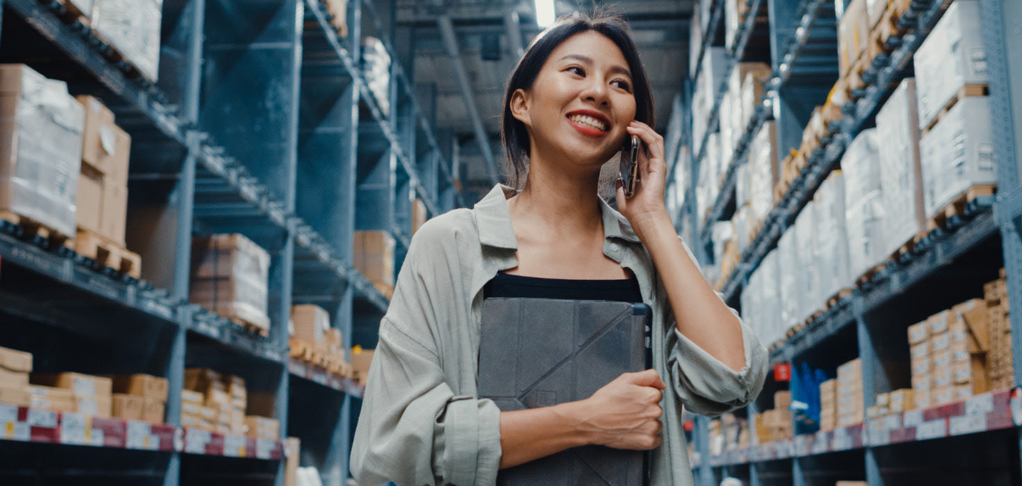 Smiling worker in a warehouse.