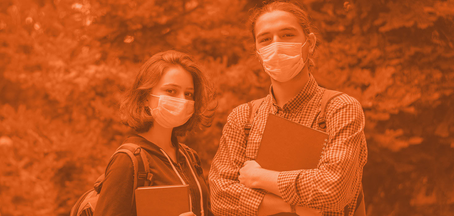 Two people holding books