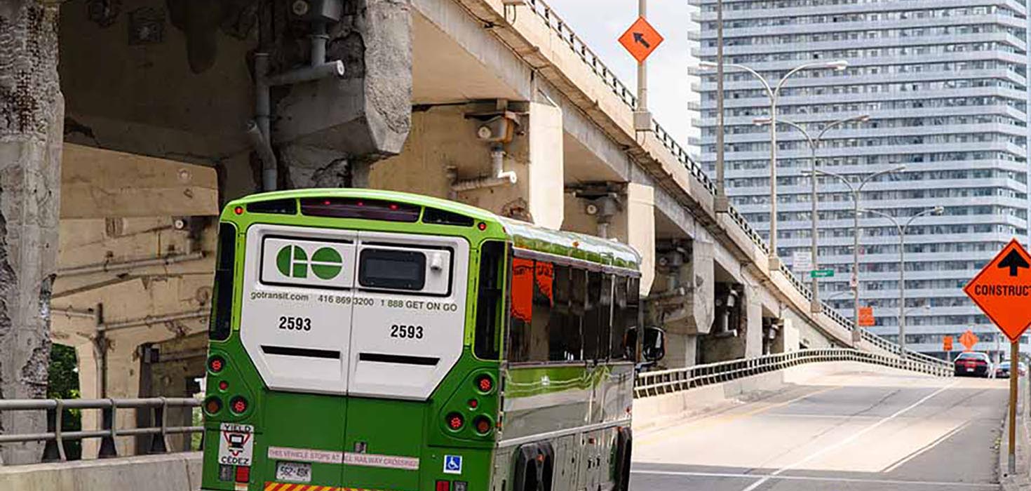 The back of a lonely GO Bus entering the Gardiner.