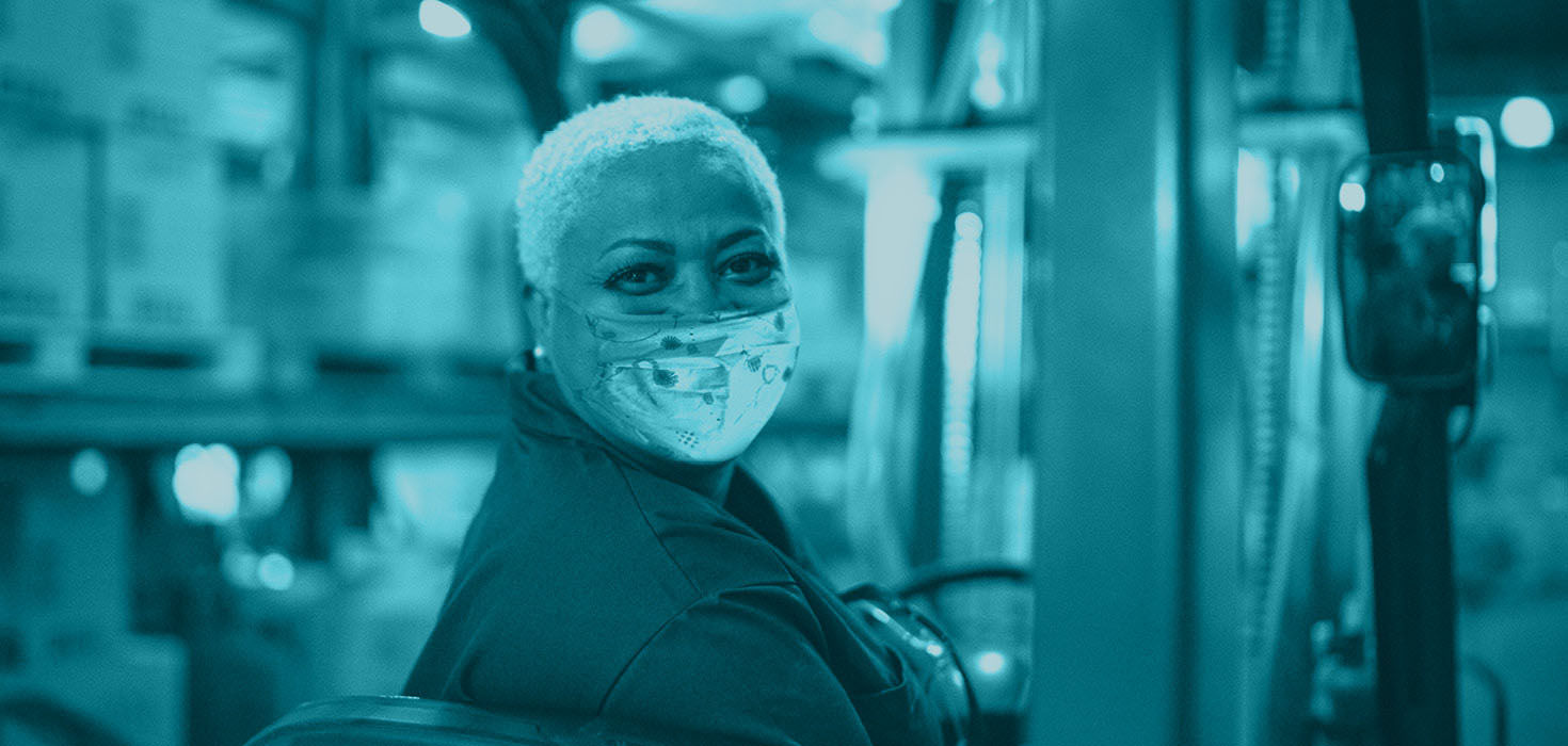 Woman in a factory looking back over her shoulder