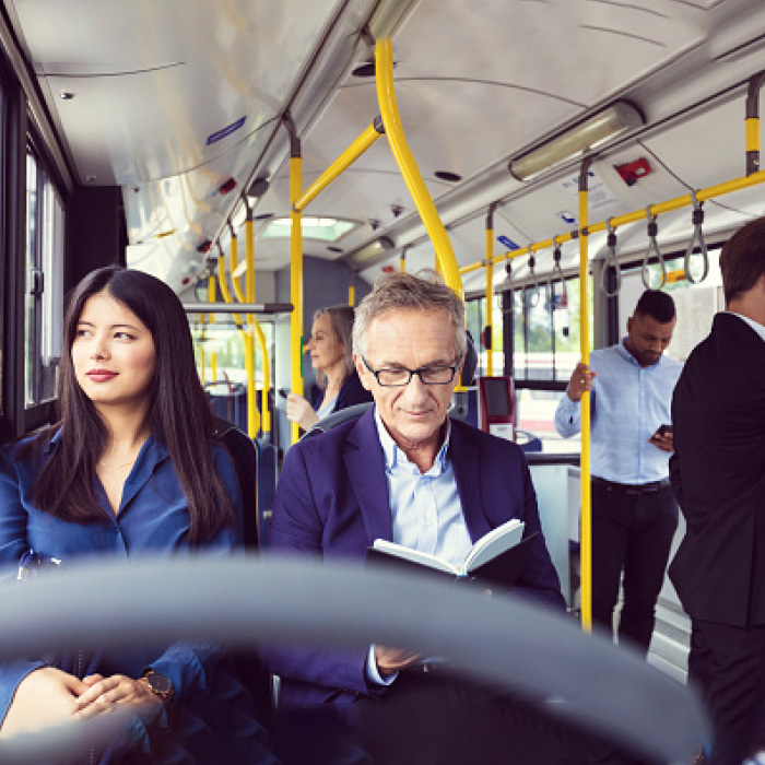 Business people riding publick transit