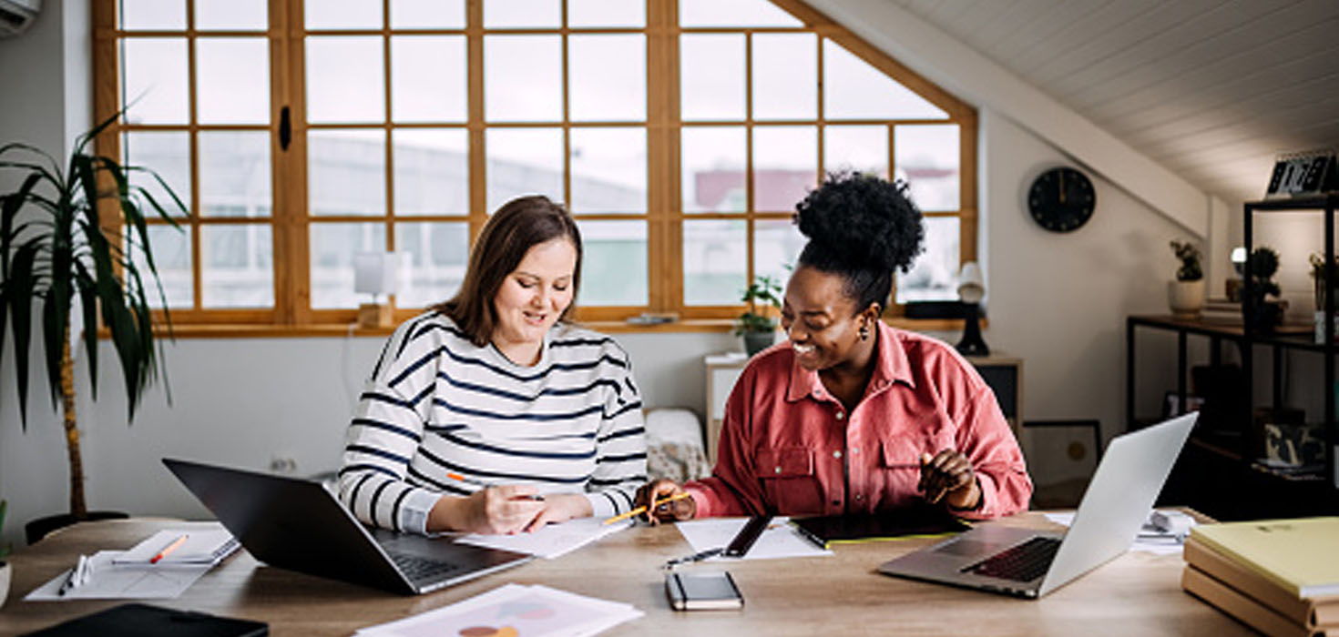 two women working together